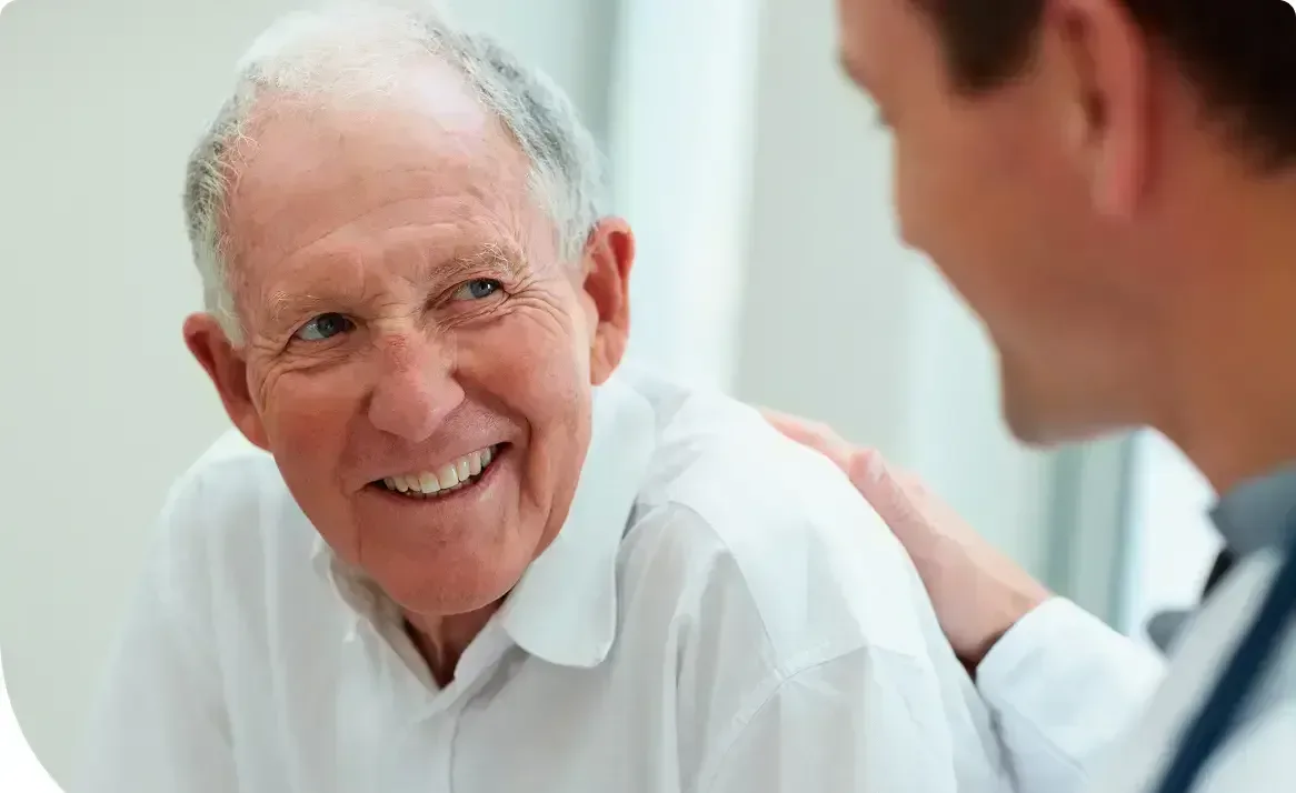 Elderly man with carer