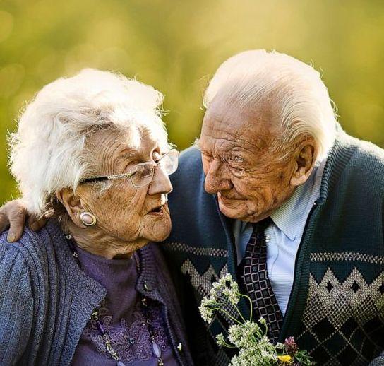 Elderly couple hugging